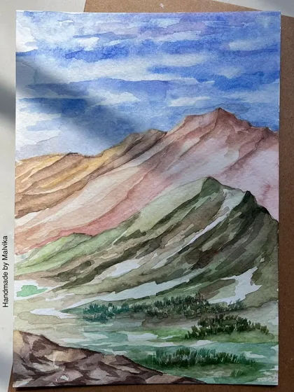 I often return to the mountains in my paintings. This watercolor piece captures the feeling of a clear day in the Himalayas, with layers of pink and green hills under a vast blue sky. It’s a moment of peace, painted from memory and available as a print.