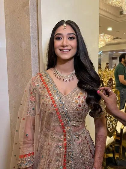 Krupali's engagement look was all about soft, romantic elegance. I created a minimal makeup look with a focus on glowing skin and paired it with classic open waves.