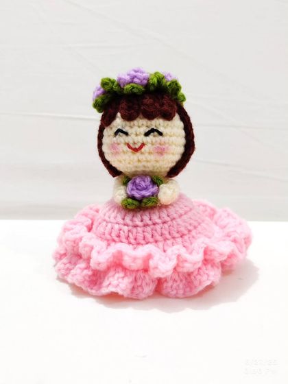 This reversible bouquet doll is two gifts in one. It starts as a beautiful floral bouquet and flips inside out to reveal an adorable doll in a pink frilly dress with a flower crown.