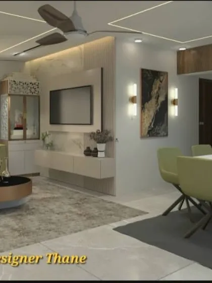 This angle shows the TV unit set against a marble-finish wall panel. The open layout connects the living and dining areas, making it ideal for modern family living in Mumbai.