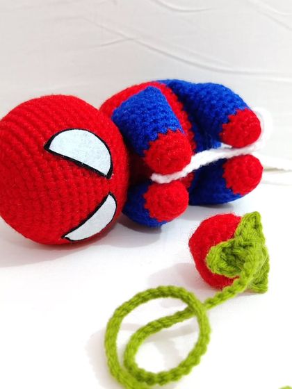 A chubby, cute Spiderman car hanging accessory, perfect for any Marvel fan.
