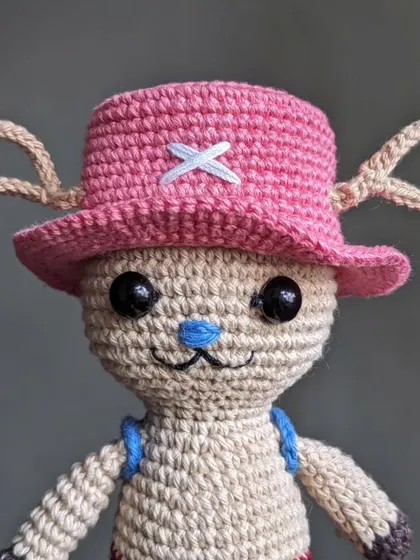 A close-up of Tony Tony Chopper from the anime One Piece, with his signature pink hat.