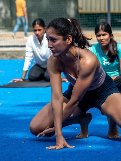 An instructor leads a functional movement session during a StrongHER workshop. We focus on practical, empowering movements that build real-world strength and body awareness.