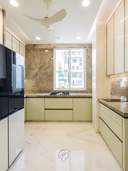 A full view of the kitchen, showing the natural light from the window and the thoughtful layout that allows for easy movement. The design is both beautiful and highly functional.