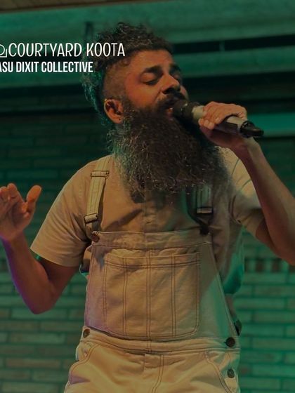 Vasu Dixit of the Vasu Dixit Collective, mid-performance. His powerful stage presence and unique folk-rock style make for an unforgettable live music experience.