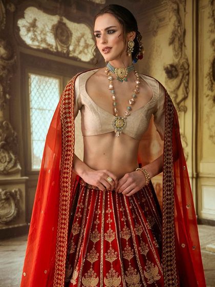 A grand, palatial room with ornate details, created with projection. This provides a regal and sophisticated setting for this beautiful bridal lehenga, enhancing its luxurious feel.