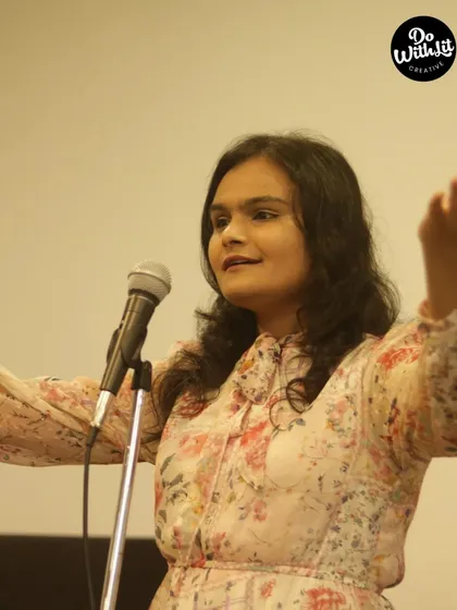A storyteller captivating the audience with her performance. Our stage is open to all languages and themes.
