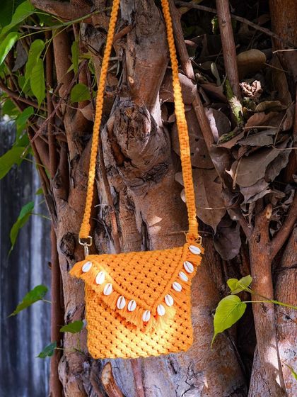My mustard yellow sling bag is pure sunshine! 🌻 This version is decorated with natural sea shells along the flap for that perfect beachy, bohemian feel. It's lightweight and just the right size for your phone, wallet, and sunglasses.