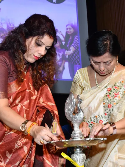 A closer look at the lamp lighting ceremony. This moment signifies our commitment to dispelling darkness through education and creativity, setting a positive tone for the celebration.