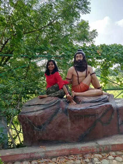Posing with a statue of a yogi in Ardha Matsyendrasana. It's fun to find inspiration for asanas everywhere you go!