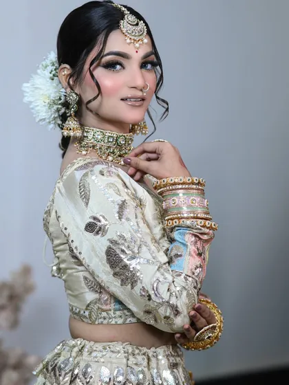 A beautiful side pose showing off the hairstyle and the detailed embroidery on the blouse.