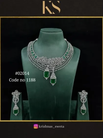 The classic emerald green version of the floral American diamond set. This timeless color combination adds a touch of royalty to the modern design.