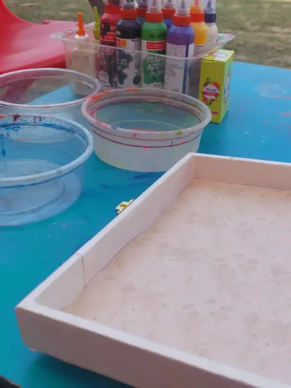 The setup for a painting activity at our stall. I make sure everything is prepared so the kids can jump right into the fun.