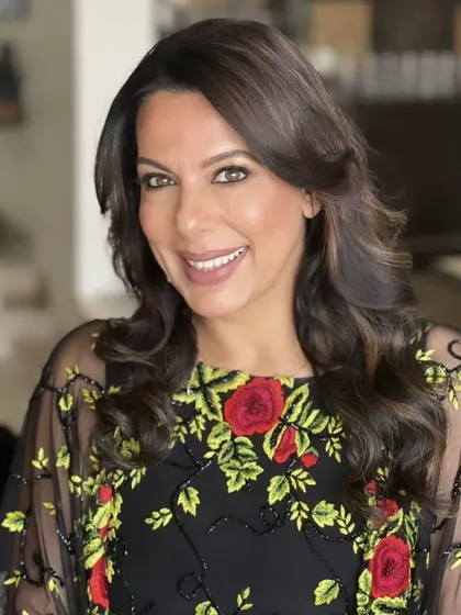 A beautiful example of how a great haircut and subtle highlights can create a look of timeless elegance. The soft waves and layers add just the right amount of volume and sophistication.