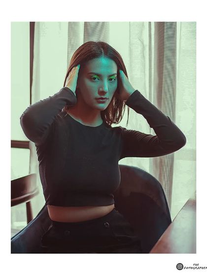 This framed version of the portrait enhances its artistic and cinematic quality, making it feel like a still from a film.