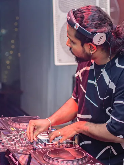 These shots capture me in my element, from different angles and at various events. Each one is a glimpse into my life as a music maker, focused on the craft and connecting with the crowd.