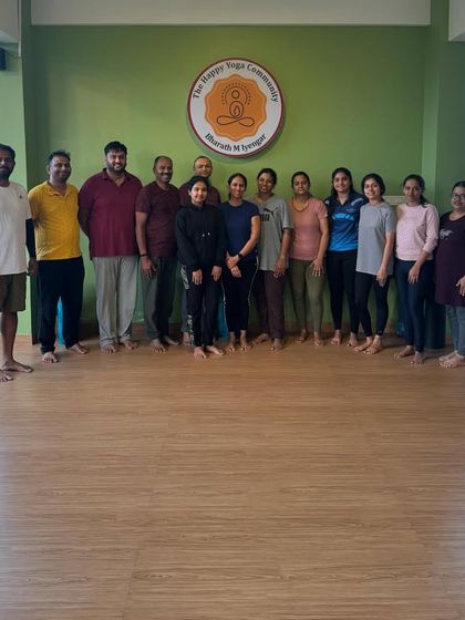 A group of smiling faces after a session. Yoga is a gift, and our mission is to share it with everyone, building a healthier and happier society together.