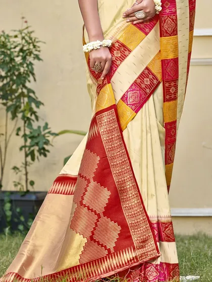 A classic Dupion silk saree is a must-have in every wardrobe. I love how the cream body contrasts with the vibrant red and yellow border, making it a timeless piece for work, pujas, or family gatherings.