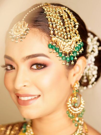 A bright, happy portrait of the groom's sister. Her smokey eyes with a hint of glitter make her look absolutely radiant and ready to celebrate.