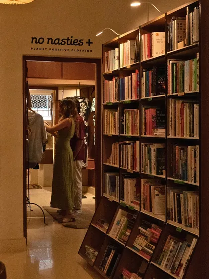 Come for the food, stay to browse. Our space includes a corner for sustainable clothing from No Nasties, right next to our beloved bookshelves.
