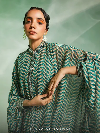 The Riley Cape Set, featuring prints that resemble tropical freshness and a breezy silhouette that flows with utter grace.