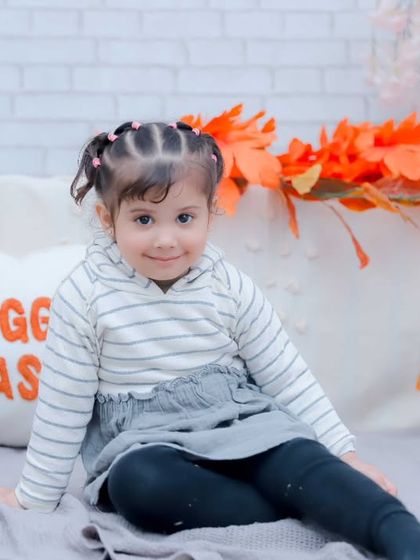 A sweet, shy smile. We capture the full range of your child's emotions and expressions.