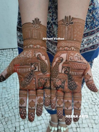 A classic design featuring majestic peacocks in a jharokha (window), giving it a royal, architectural feel.