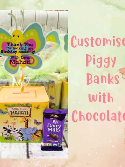 This jungle-themed piggy bank is a great way to encourage saving. It comes with a chocolate treat and is wrapped in netting with a personalized butterfly tag for a birthday girl named Mahati.