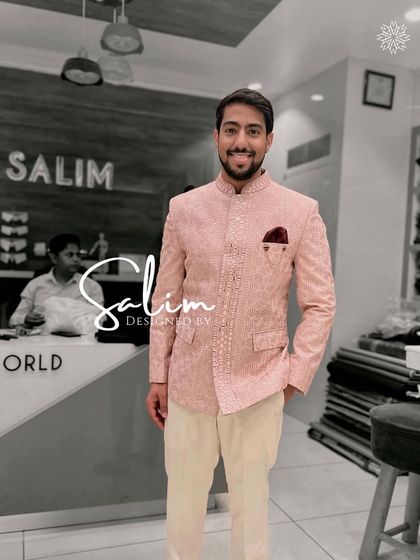 A client wearing a light pink Jodhpuri jacket with delicate embroidery. This is a soft and elegant look, ideal for a sophisticated daytime celebration.