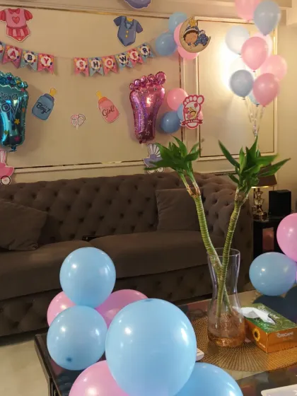 The full living room setup for the baby shower, creating a festive and welcoming atmosphere.