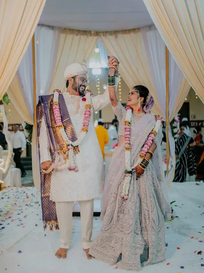 A moment of pure celebration as the bride and groom exchange garlands during the Varmala ceremony. I capture the energy and joy of this key Maharashtrian wedding ritual.