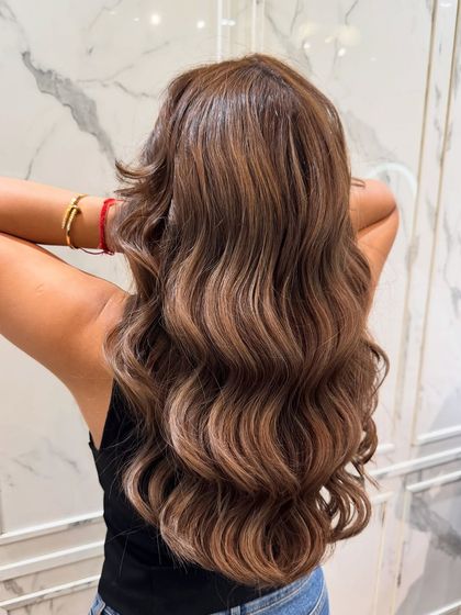 A close-up of the walnut balayage, highlighting the intricate placement of colors and the hair's beautiful texture.