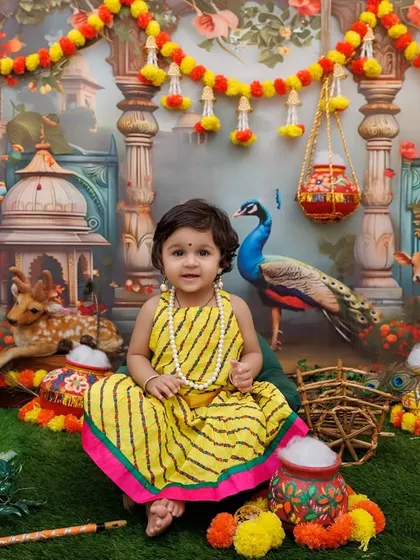 A wide shot showing a little Radha in the complete Gokul setup, giving a sense of the immersive environment I create.
