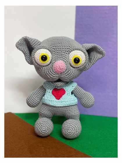 I pattern tested this unique grey creature, who looks a bit like a cat, for a fellow designer. His big, expressive eyes and the little heart on his shirt are my favorite parts.