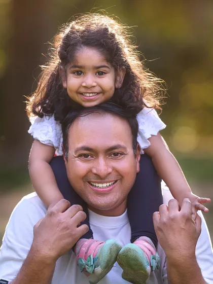A classic portrait of a daughter enjoying a shoulder ride. I make sure to capture these simple, happy moments that you'll cherish for years to come.