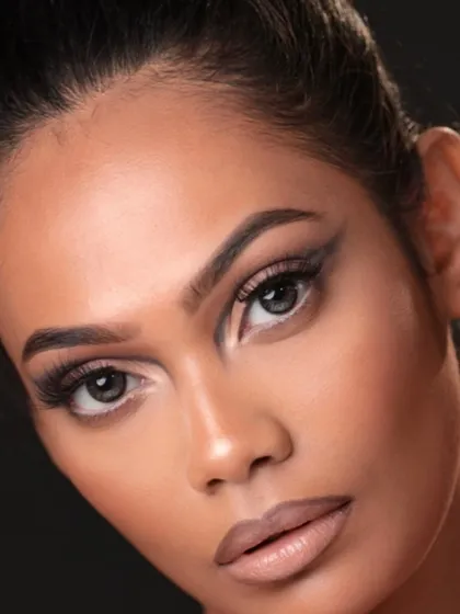 A direct portrait showing the full effect of the sharp, modern eyeliner style.