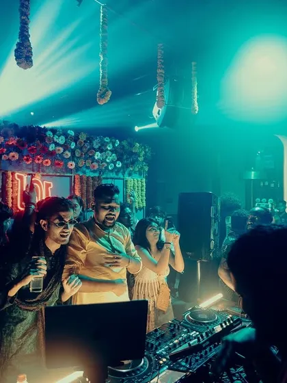 Sharing a moment with the crew behind the decks. We're all there for the same reason: to create an unforgettable party.