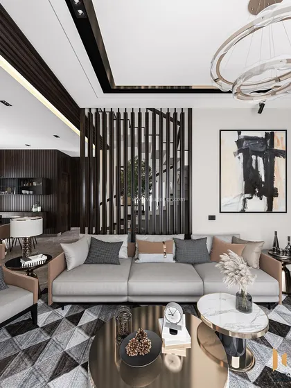 This living room uses a metal and wood partition to create a subtle separation while maintaining an open feel, drawing the eye towards the staircase.