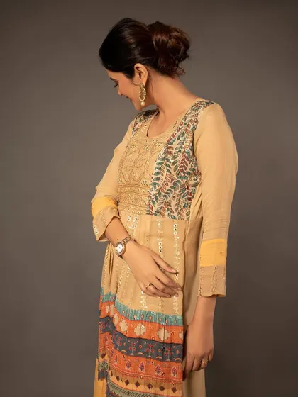 A shot focusing on the upper half of the dress from a different angle, again highlighting the beautiful fabric and fit.