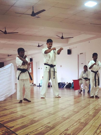 Even inside, the training is intense. I lead a class of black belt students, refining their kata. Mastery is a journey without an end.