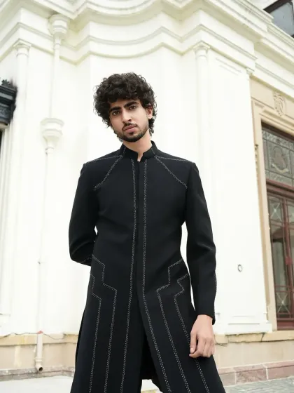 A front view of the minimalist black indowestern, highlighting the clean lines.