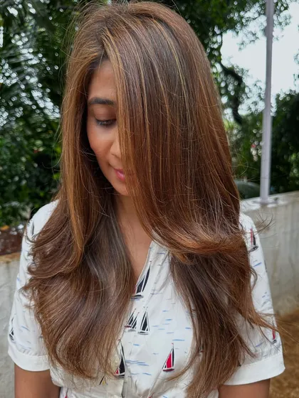 Holiday hair goals. This beautiful balayage combines different shades of blonde and light brown for a perfectly blended, sun-kissed look that’s ready for any adventure.