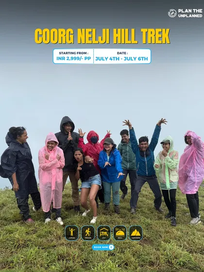 A group of trekkers in raincoats having fun on the Coorg Nelji Hill trek.