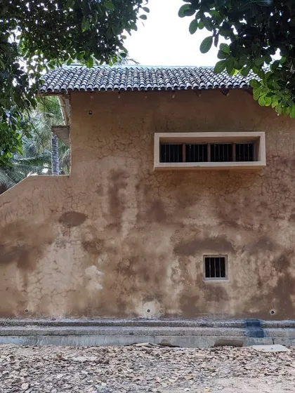 The exterior of an outbuilding at the Hassan farmhouse, showcasing the beauty of unfinished, natural mud plaster.