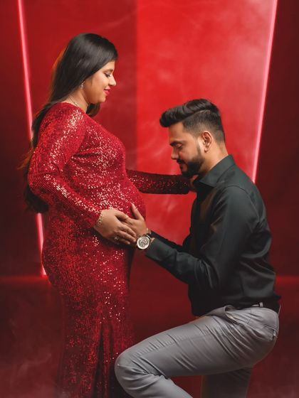 A classic maternity pose where the dad-to-be gently holds the baby bump, symbolizing their shared journey.