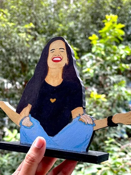 This wooden miniature captures such a joyful, carefree moment. It's a great example of how I can turn a fun photo into a unique piece of art that you can display anywhere.