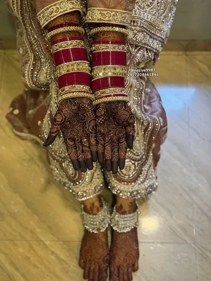 The final 'rang'. This is the deep, dark color that every bride dreams of, perfectly complementing her bridal choora (bangles).