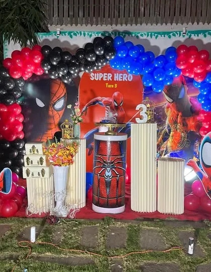 A different Spiderman setup with multiple character cutouts and a backdrop featuring the superhero, perfect for a young fan's party.