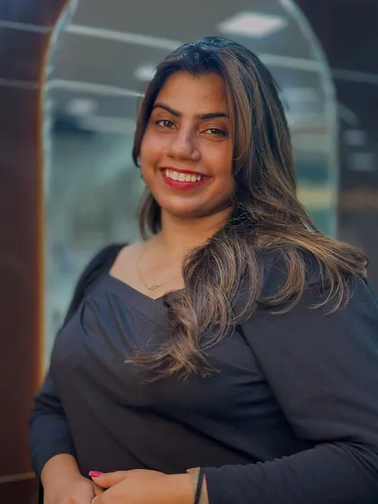 A beautiful portrait of a client enjoying her new look. The subtle highlights enhance her natural beauty without overpowering it.