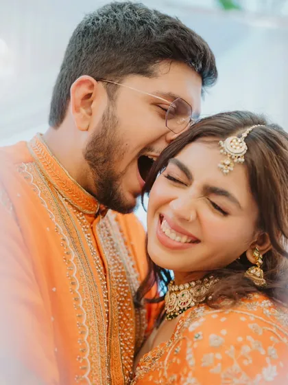 The pure, uninhibited joy of an engagement celebration. This candid shot of Hinal and Jeet is one of my favorites because it is completely real. It is a moment of playful affection that you can feel just by looking at it.